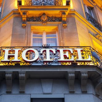 Illuminated hotel sign taken in Paris at night